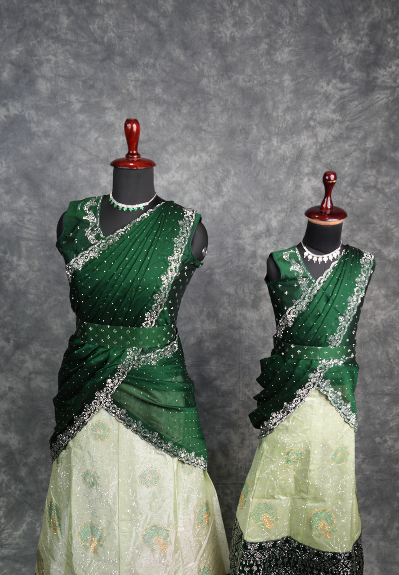 Elegant Green with Dark Green Lehenga featuring rich designer detailing, premium layered drape style, sparkling stone work, graceful festive appearance, stylish traditional outfit for girls, perfect for weddings, receptions & special occasions