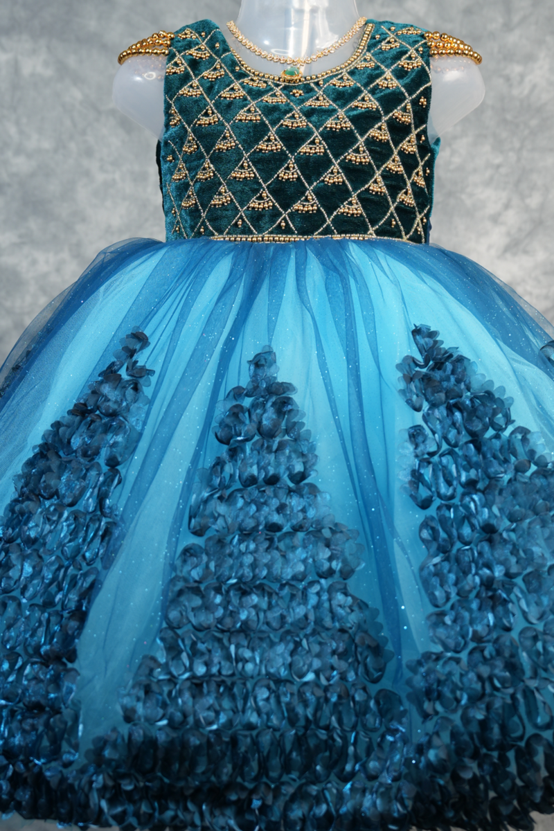 Deep Teal with Peacock Blue Frock for Baby Girls 1–3 Years Stunning teal velvet bodice with gold embroidery, vibrant peacock blue 3D rosette skirt & satin bow. Perfect for birthdays & parties
