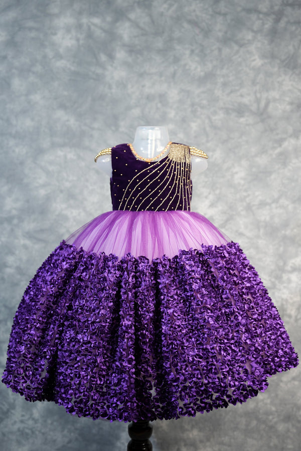 Deep Plum with light purple Frock for Baby Girls Rich velvet bodice with stunning diagonal gold bead embroidery, lavender tulle waist & fully bloomed purple rosette skirt. Ideal for birthdays & parties