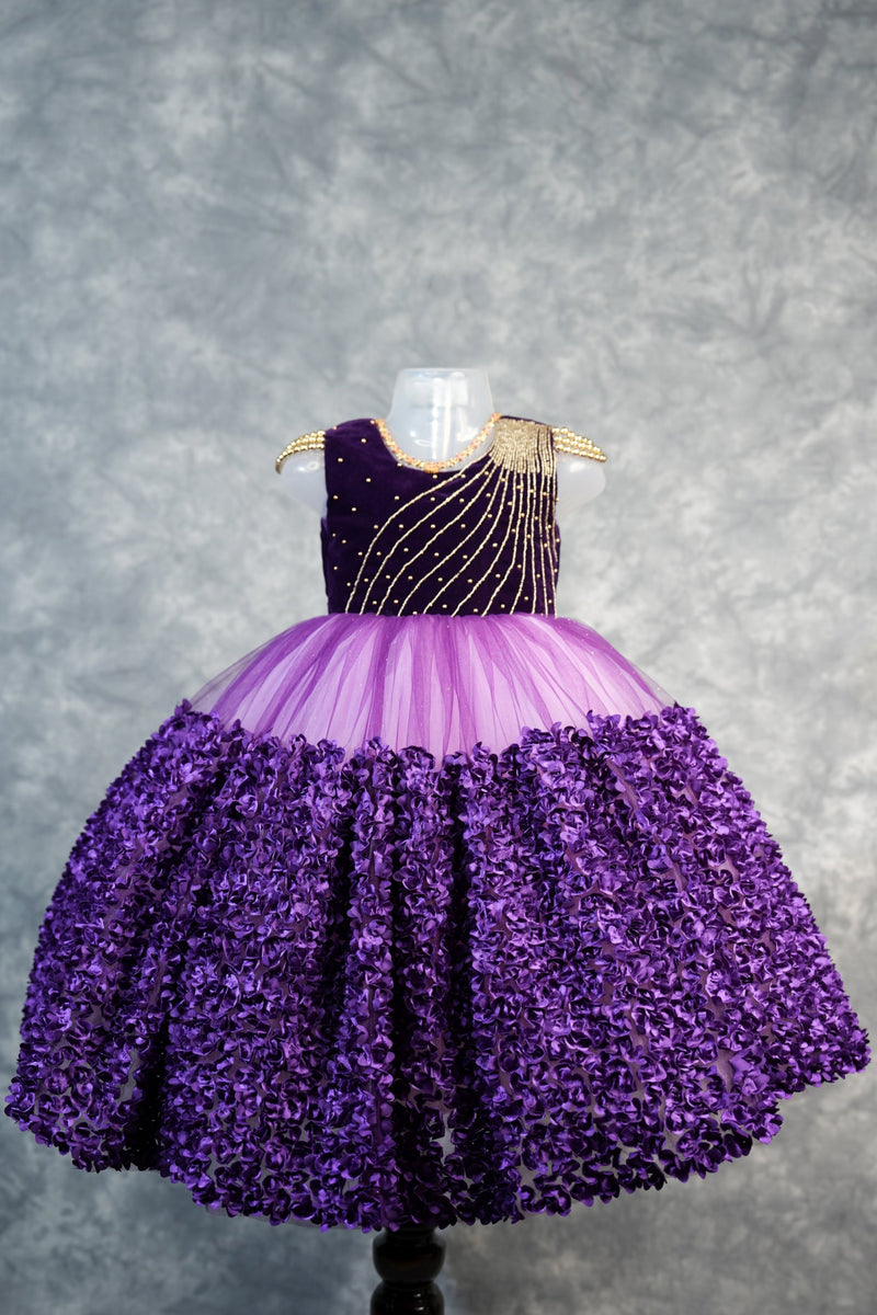 Deep Plum with light purple Frock for Baby Girls Rich velvet bodice with stunning diagonal gold bead embroidery, lavender tulle waist & fully bloomed purple rosette skirt. Ideal for birthdays & parties