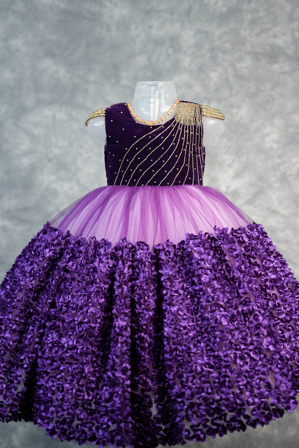 Deep Plum with light purple Frock for Baby Girls Rich velvet bodice with stunning diagonal gold bead embroidery, lavender tulle waist & fully bloomed purple rosette skirt. Ideal for birthdays & parties