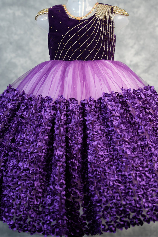 Deep Plum with light purple Frock for Baby Girls Rich velvet bodice with stunning diagonal gold bead embroidery, lavender tulle waist & fully bloomed purple rosette skirt. Ideal for birthdays & parties
