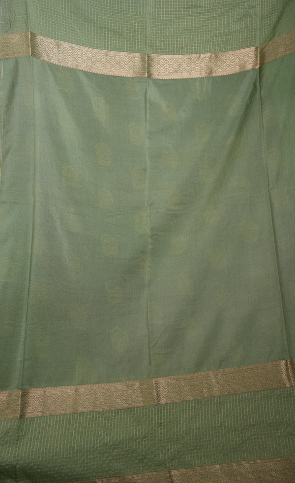 Green fabric with gold border and pattern
