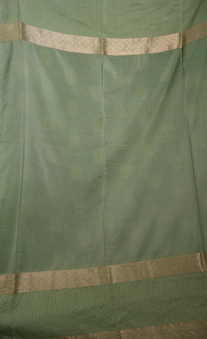 Green fabric with gold border and pattern