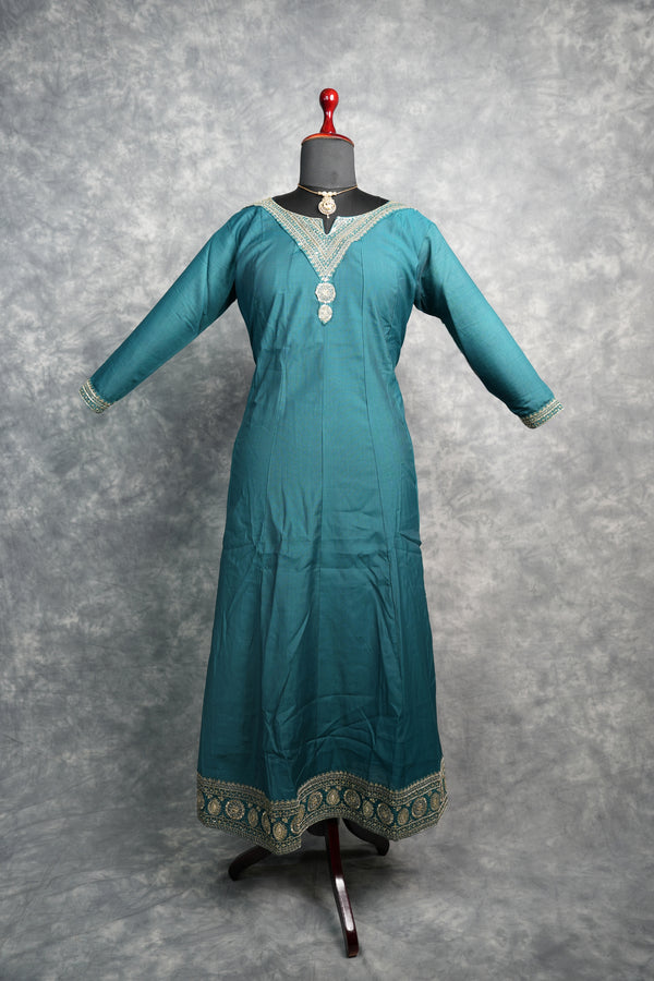 Deep Teal Anarkali Churidar Set - Stunning deep teal silk anarkali with gold zari embroidery, sequin work & rich embellished borders. A graceful, festive pick for weddings & celebrations.