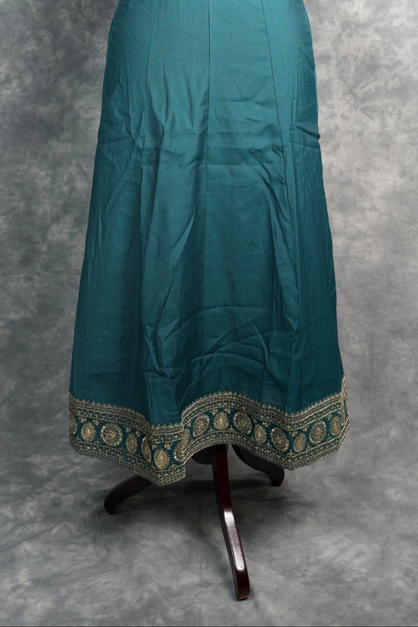 Deep Teal Anarkali Churidar Set - Stunning deep teal silk anarkali with gold zari embroidery, sequin work & rich embellished borders. A graceful, festive pick for weddings & celebrations.