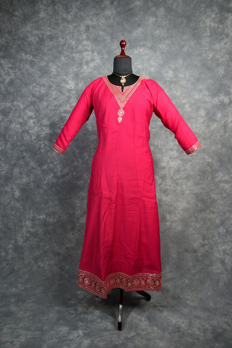 Rani Pink Anarkali Churidar Set – Rich silk elegance with intricate gold zari work, sequin embellishments, and detailed borders, creating a graceful and eye-catching ethnic look.