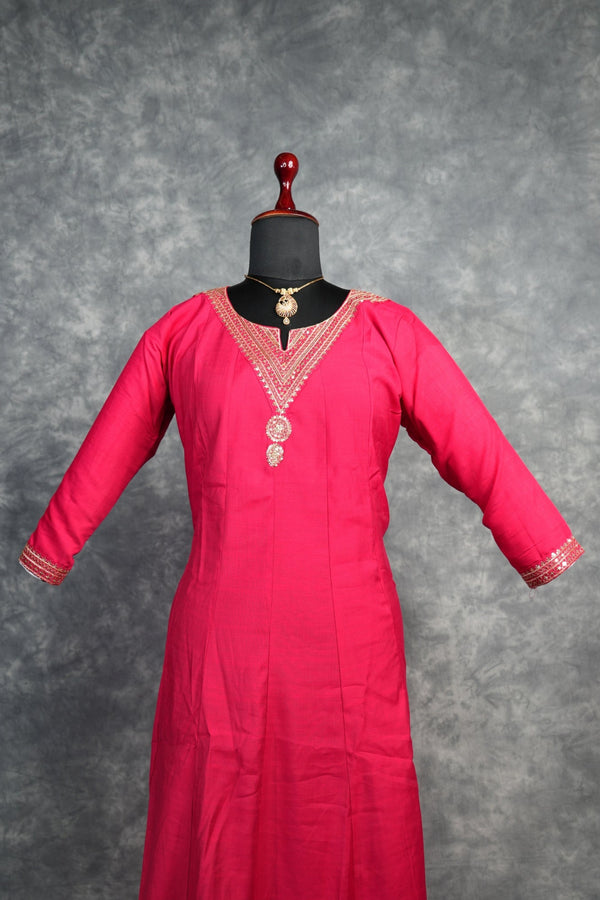 Rani Pink Anarkali Churidar Set – Rich silk elegance with intricate gold zari work, sequin embellishments, and detailed borders, creating a graceful and eye-catching ethnic look.