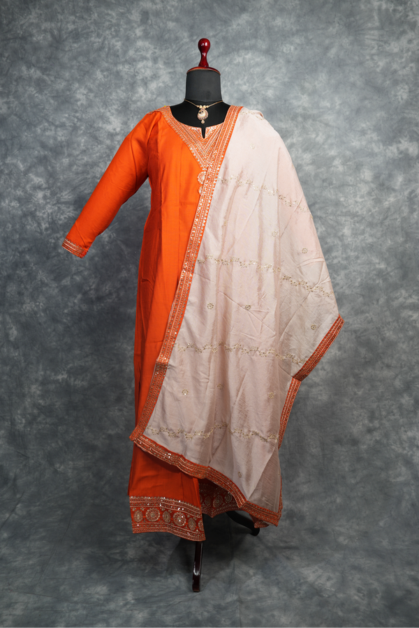 Rust Orange Anarkali Churidar Set Rich colour Elegant zari work Mirror embellishments Designer sleeve borders ,A graceful outfit that blends traditional charm with modern elegance for every special celebration