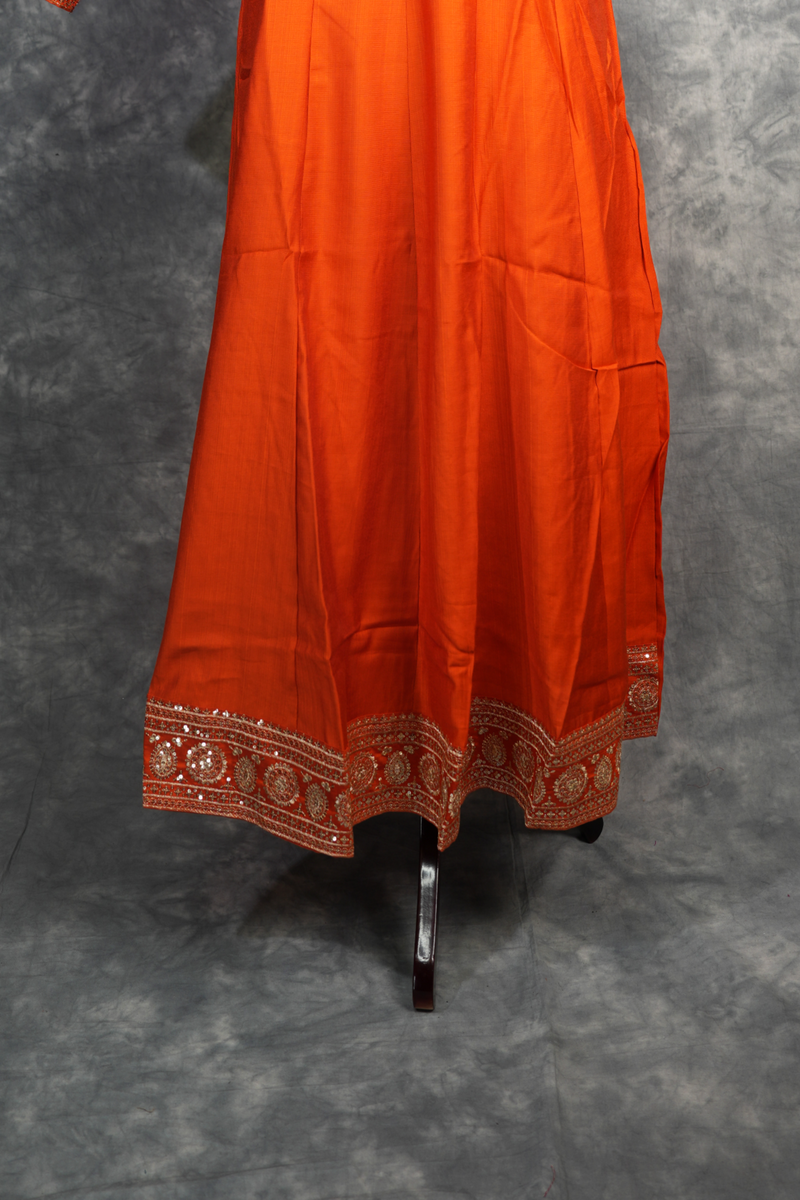Rust Orange Anarkali Churidar Set Rich colour Elegant zari work Mirror embellishments Designer sleeve borders ,A graceful outfit that blends traditional charm with modern elegance for every special celebration