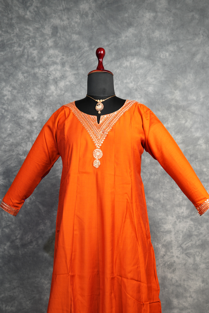 Rust Orange Anarkali Churidar Set Rich colour Elegant zari work Mirror embellishments Designer sleeve borders ,A graceful outfit that blends traditional charm with modern elegance for every special celebration