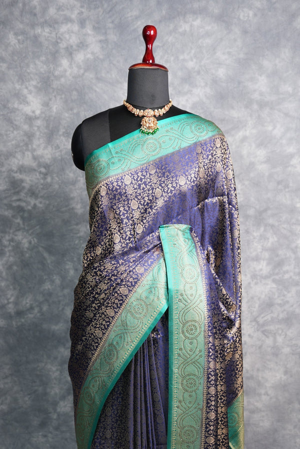 Navy Blue Banarasi Silk Saree with Teal Turquoise Border & Antique Gold Zari Weave – All-Over Floral Brocade Body, Heavy Designer Pallu & Matching Blouse Ideal for Grand Occasions & Traditional Gatherings