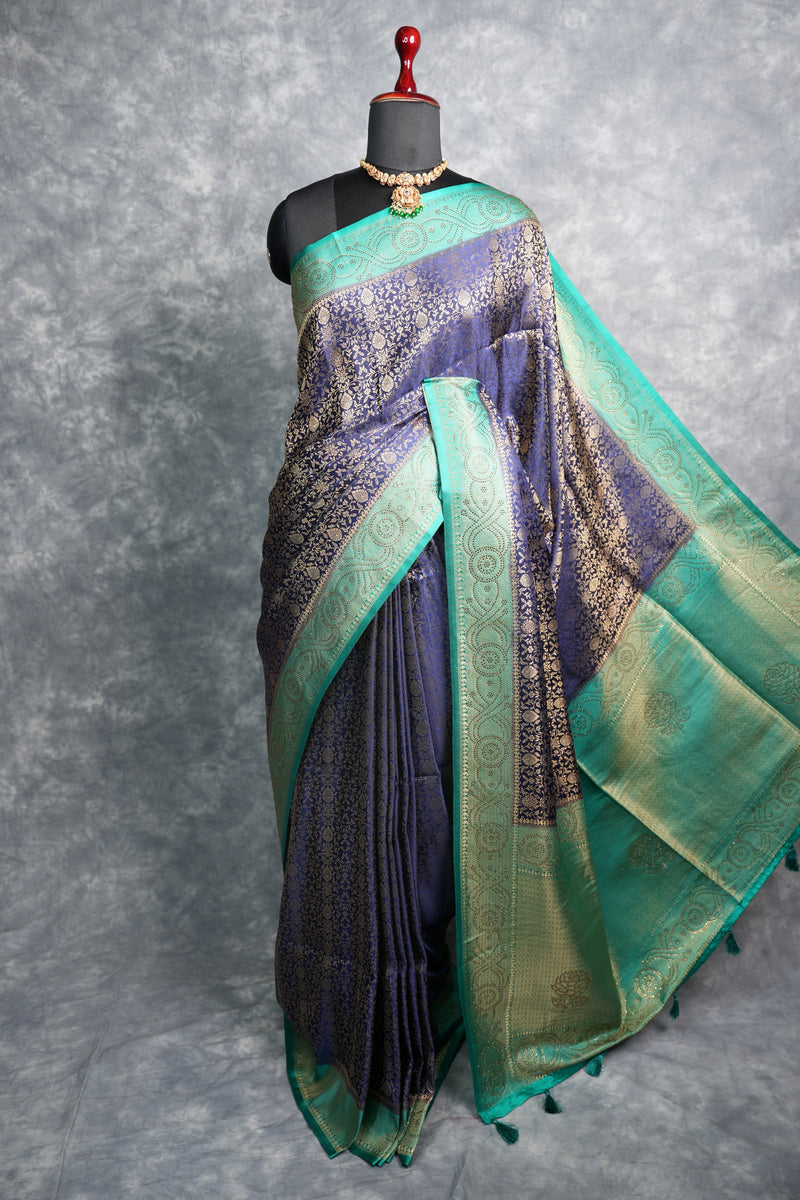 Navy Blue Banarasi Silk Saree with Teal Turquoise Border & Antique Gold Zari Weave – All-Over Floral Brocade Body, Heavy Designer Pallu & Matching Blouse Ideal for Grand Occasions & Traditional Gatherings