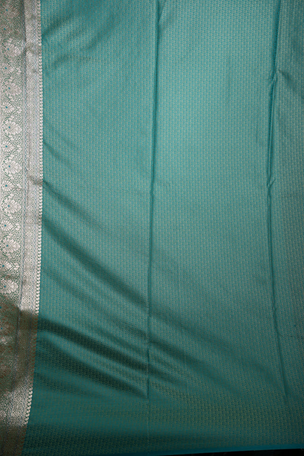 Teal fabric with a subtle pattern on a plain background