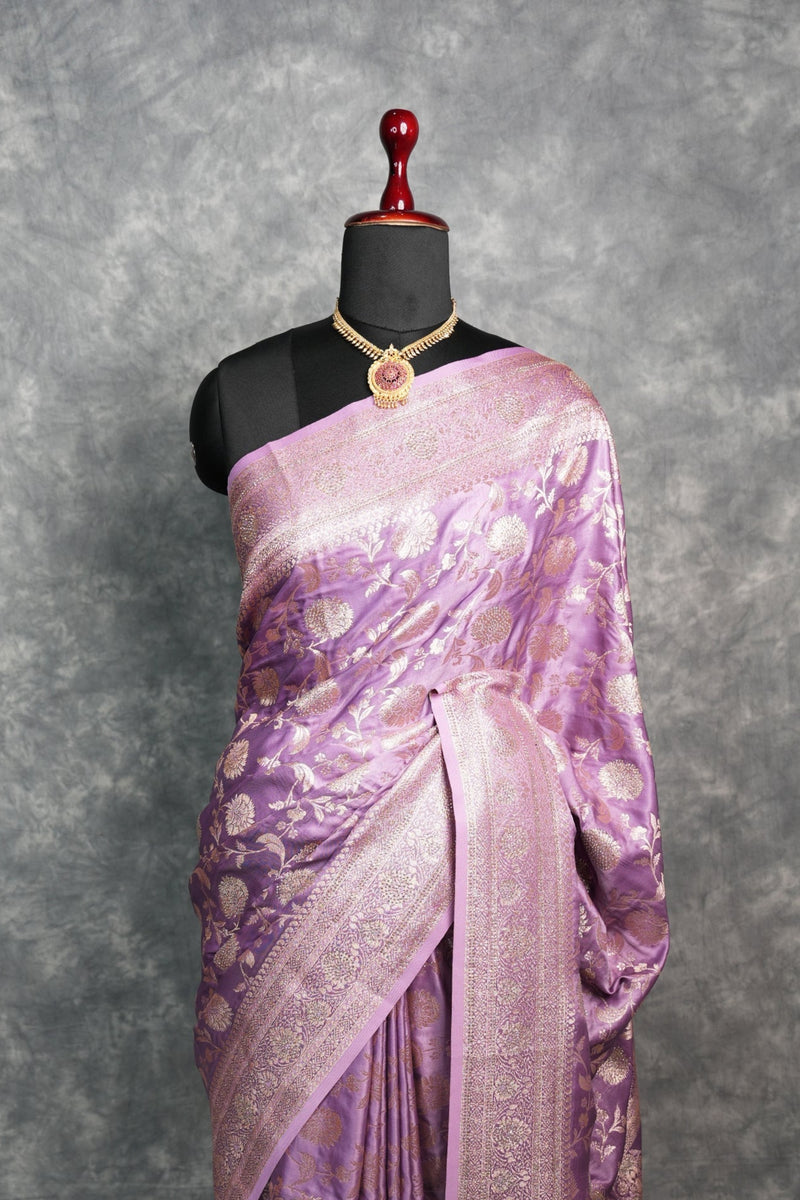 Purple saree with a mannequin on a gray background