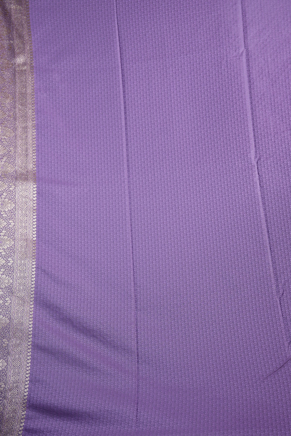Close-up of purple fabric with a silver border