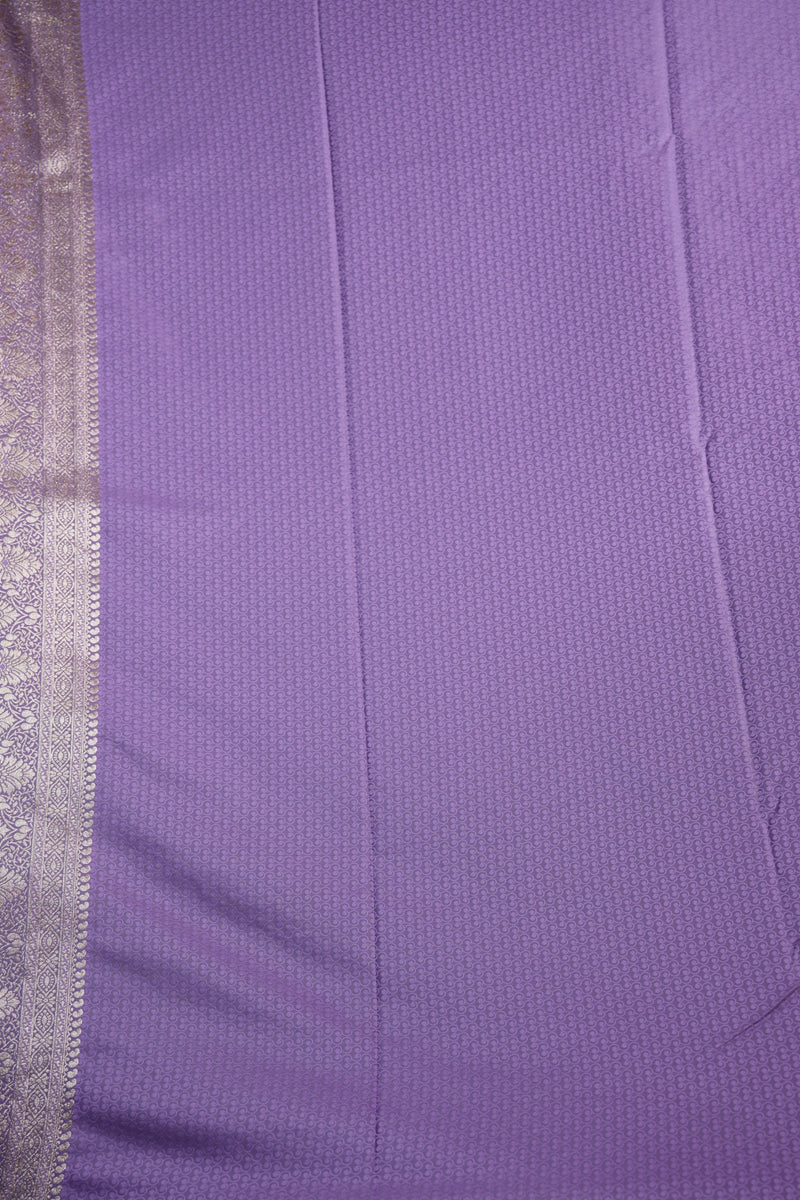 Close-up of purple fabric with a silver border