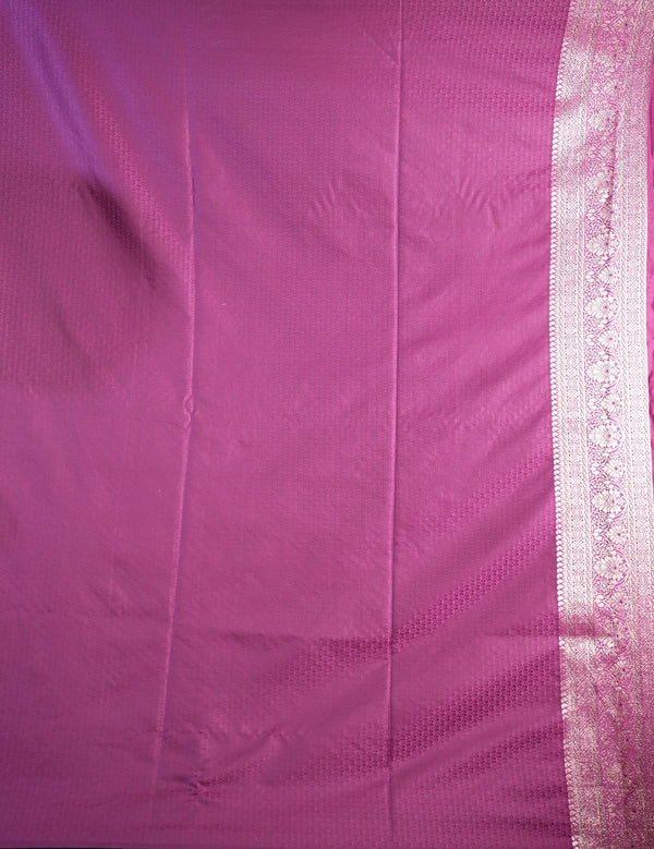 Close-up of pink fabric with a white border