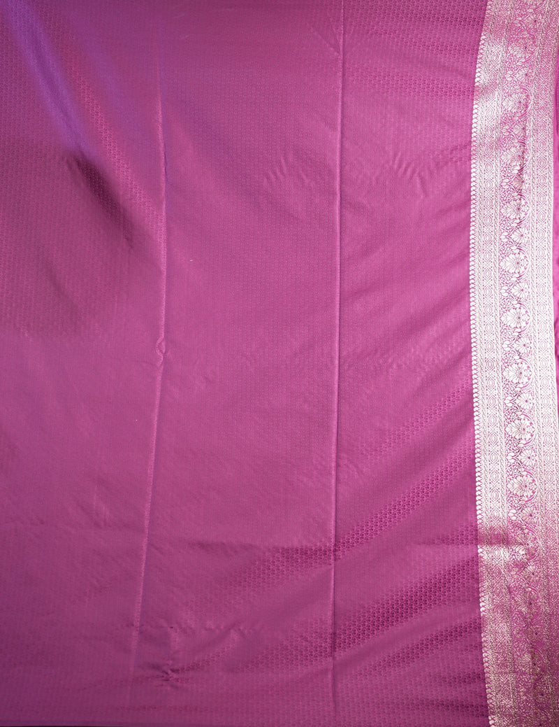 Close-up of pink fabric with a white border
