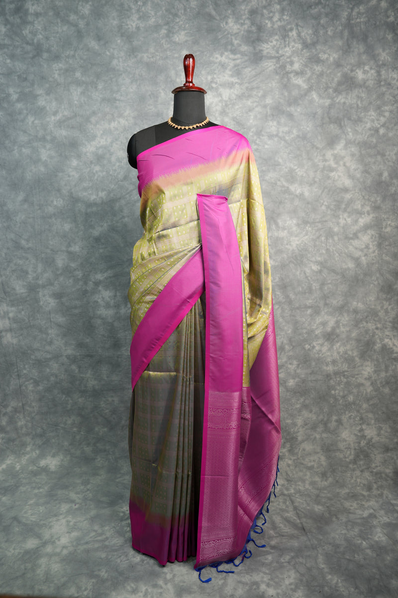Traditional outfit with a pink and gold sash on a gray background