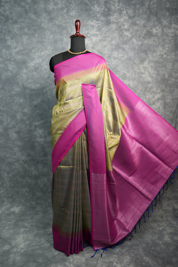Purple and gold saree on a gray background
