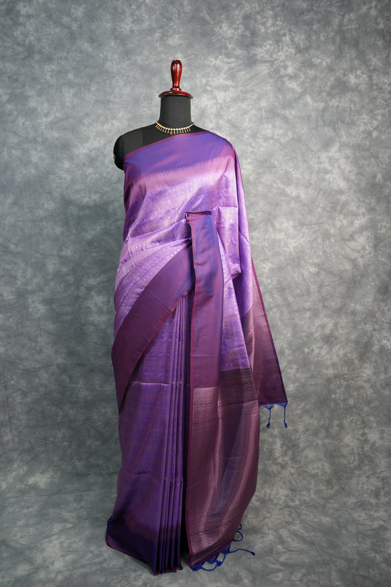 Lavender & Deep Purple Soft Silk Saree Silver Zari Check Weave & Small Buttas Body Broad Dark Purple Zari Border Intricate Temple Pallu Design Blue Tassel Finish Bridal & Festive Wear