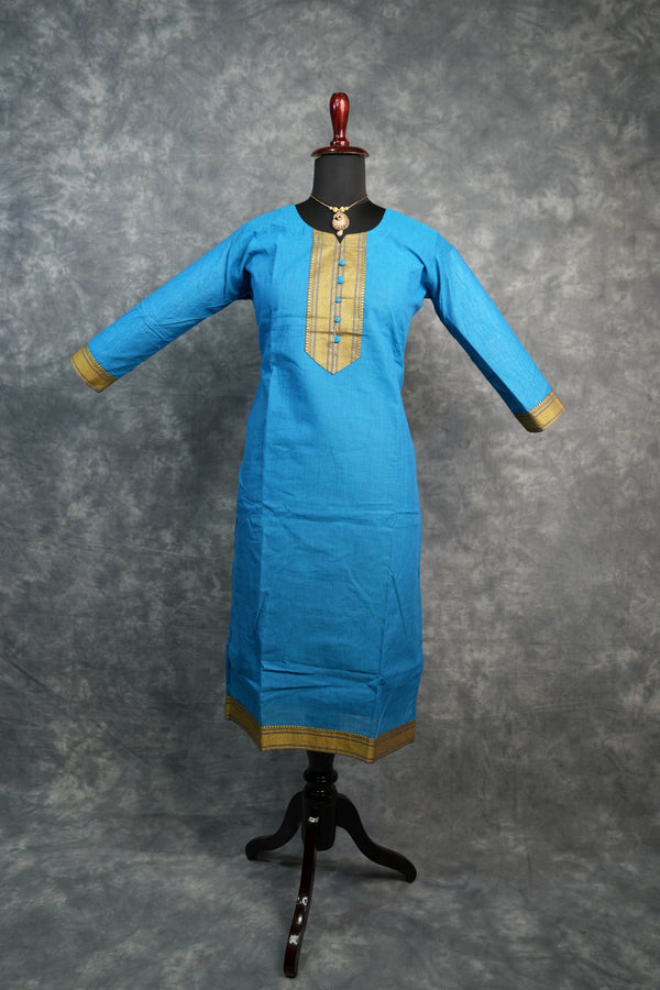 Blue kurta on a mannequin against a gray background