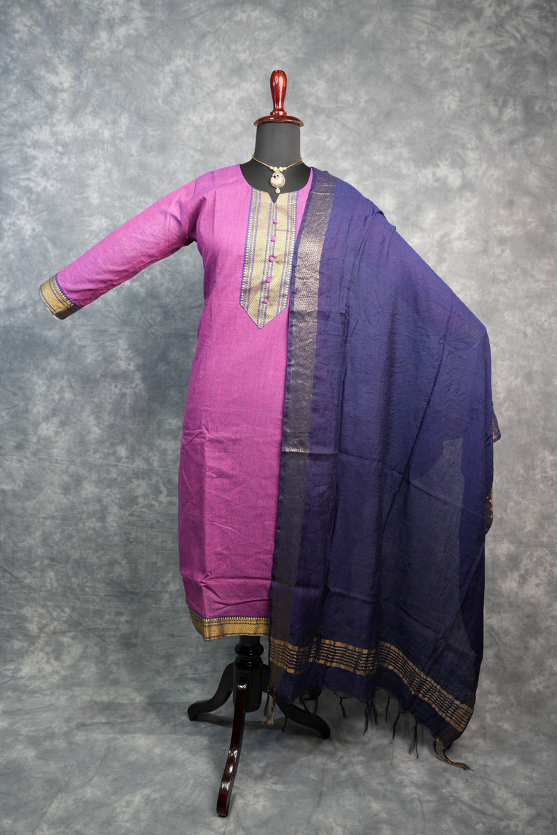 Purple and pink traditional garment on a gray background