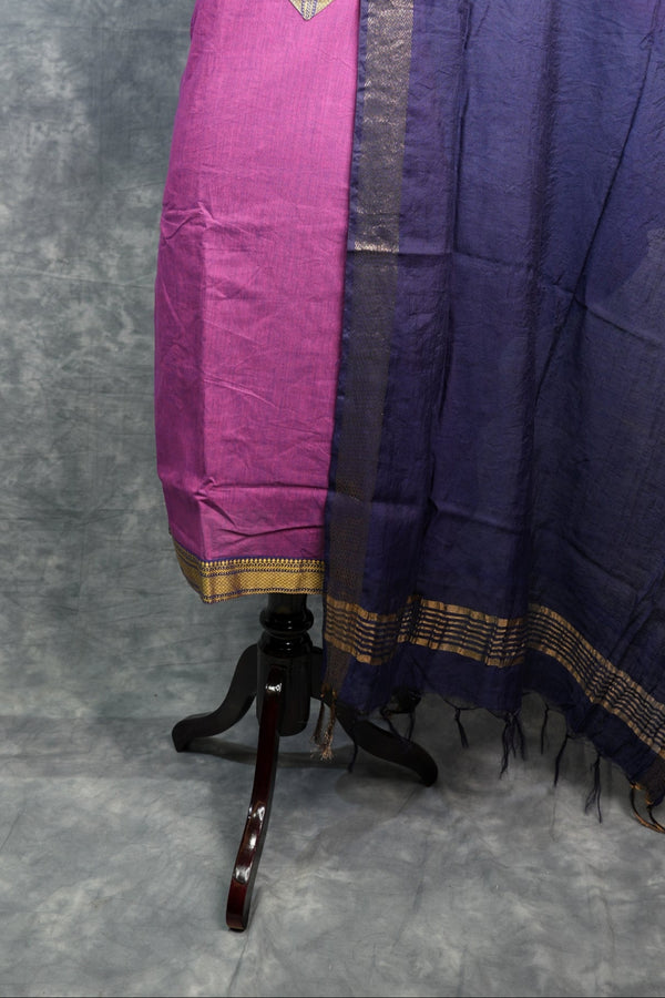 Purple and pink traditional garment on a gray background