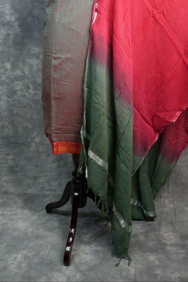 Umbrella with red and green fabric on a gray background