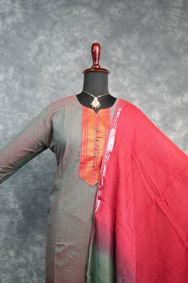 Umbrella with red and green fabric on a gray background