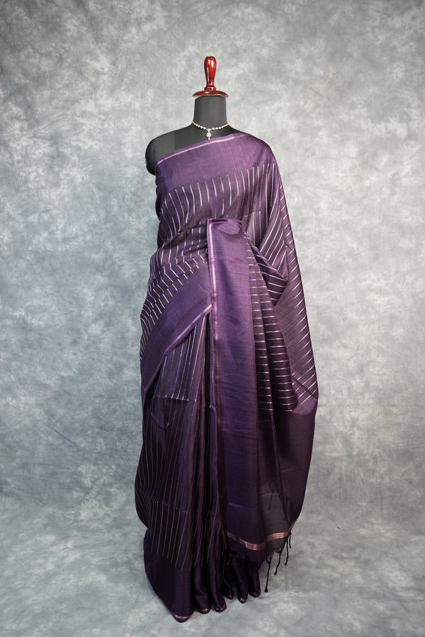Purple saree with white stripes on a mannequin against a gray background