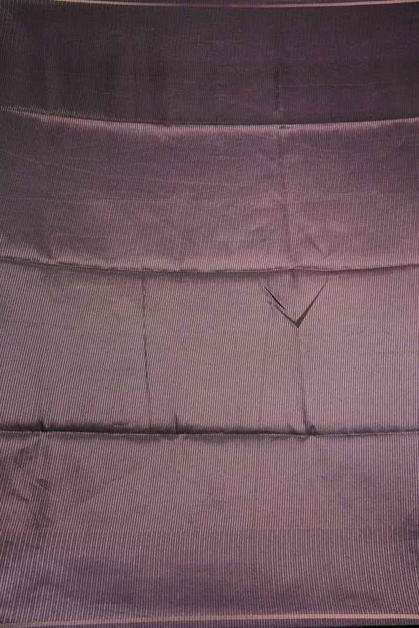 Close-up of a textured purple fabric with a subtle pattern