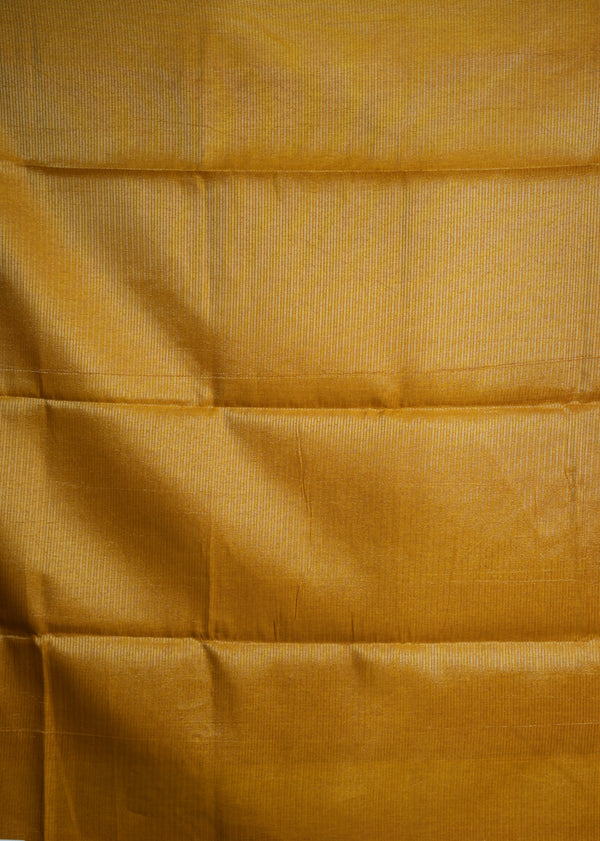 Close-up of mustard yellow fabric with a textured pattern