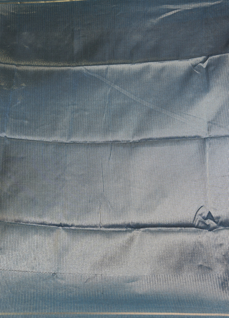 Close-up of a textured blue fabric surface