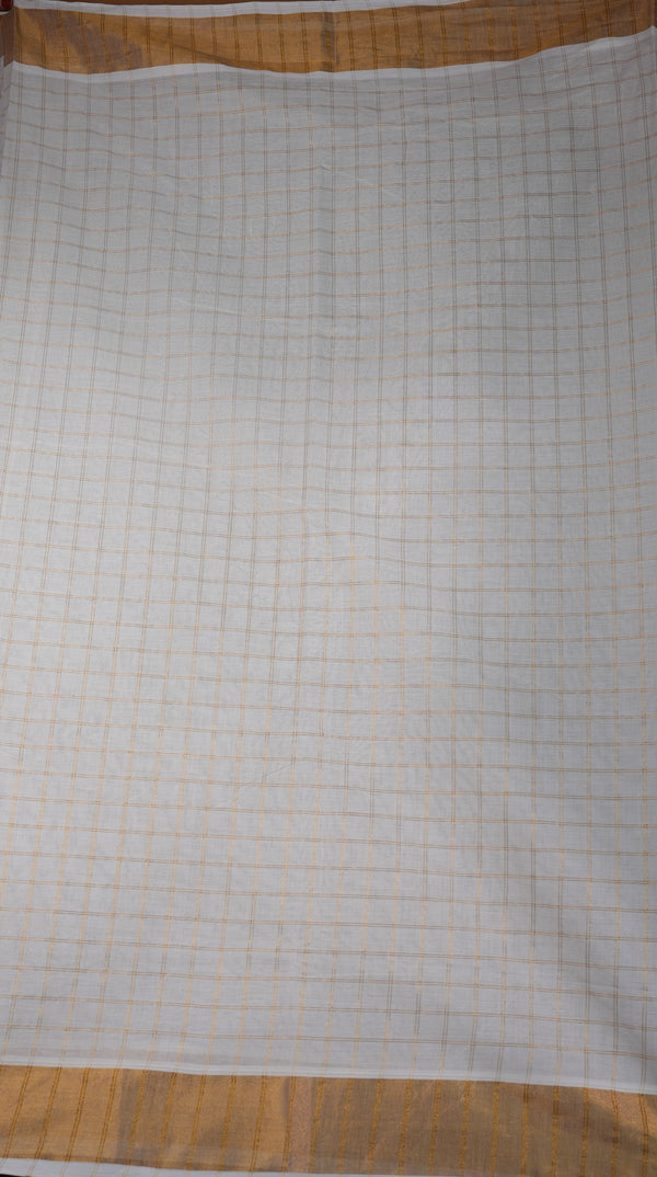 A square white fabric cloth with a fine orange grid pattern and a solid orange border, laid flat on a wooden surface.