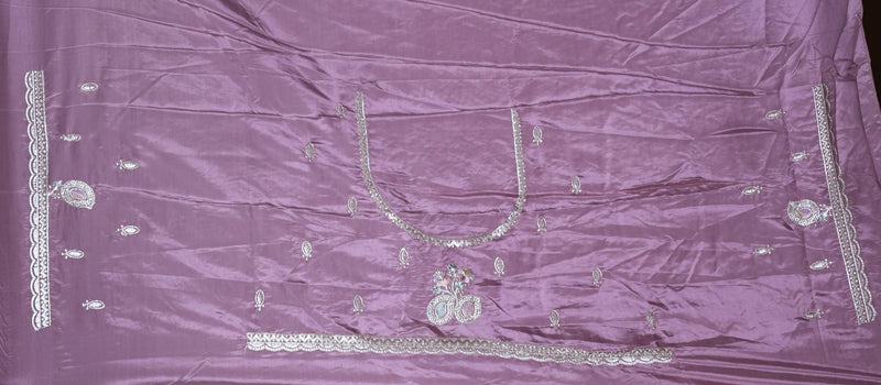 A Mauve satin fabric, likely a dupatta or sari, featuring silver mirror work embroidery and metallic embellishments arranged symmetrically.