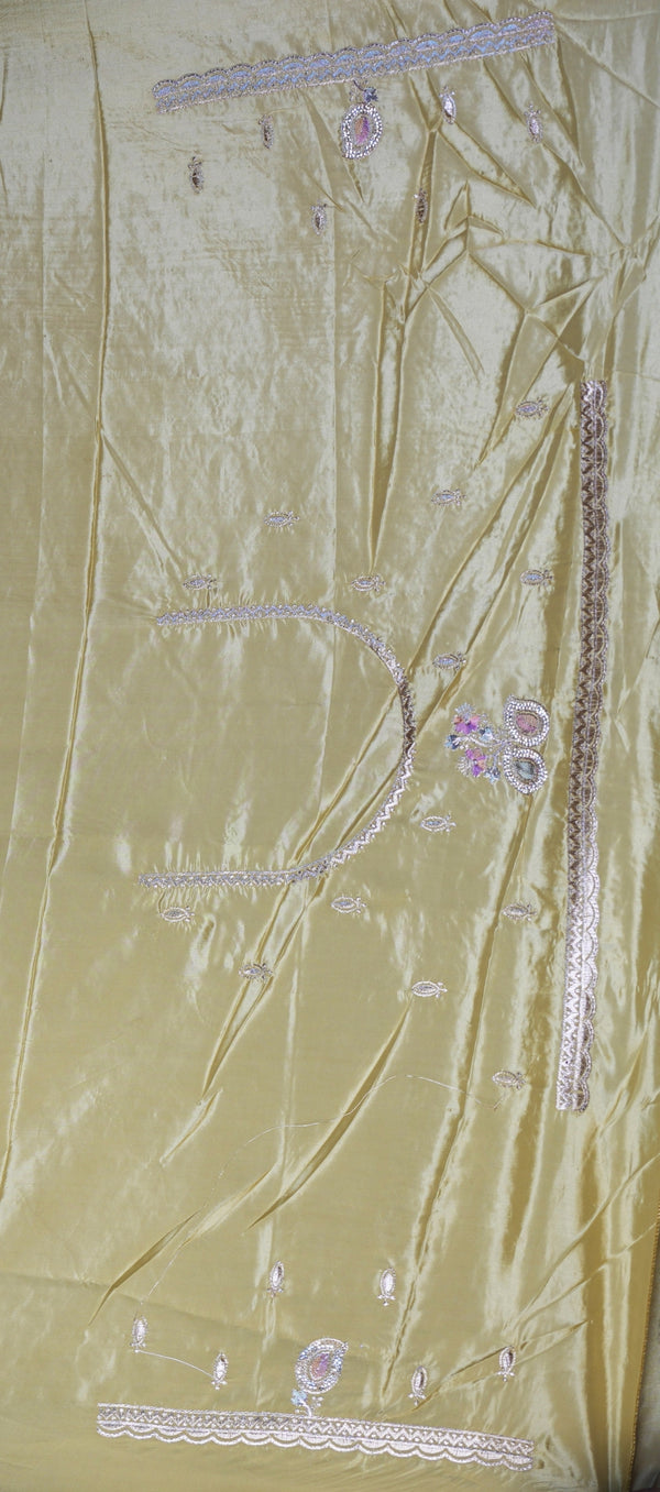 A light gold satin fabric panel with pink and silver floral embroidery and decorative borders, laid flat.
