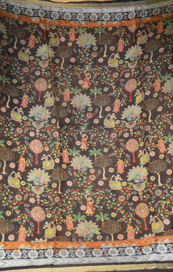 A dark brown fabric featuring an intricate, colorful traditional folk art print of trees, flowers, and figures, finished with a decorative patterned border.