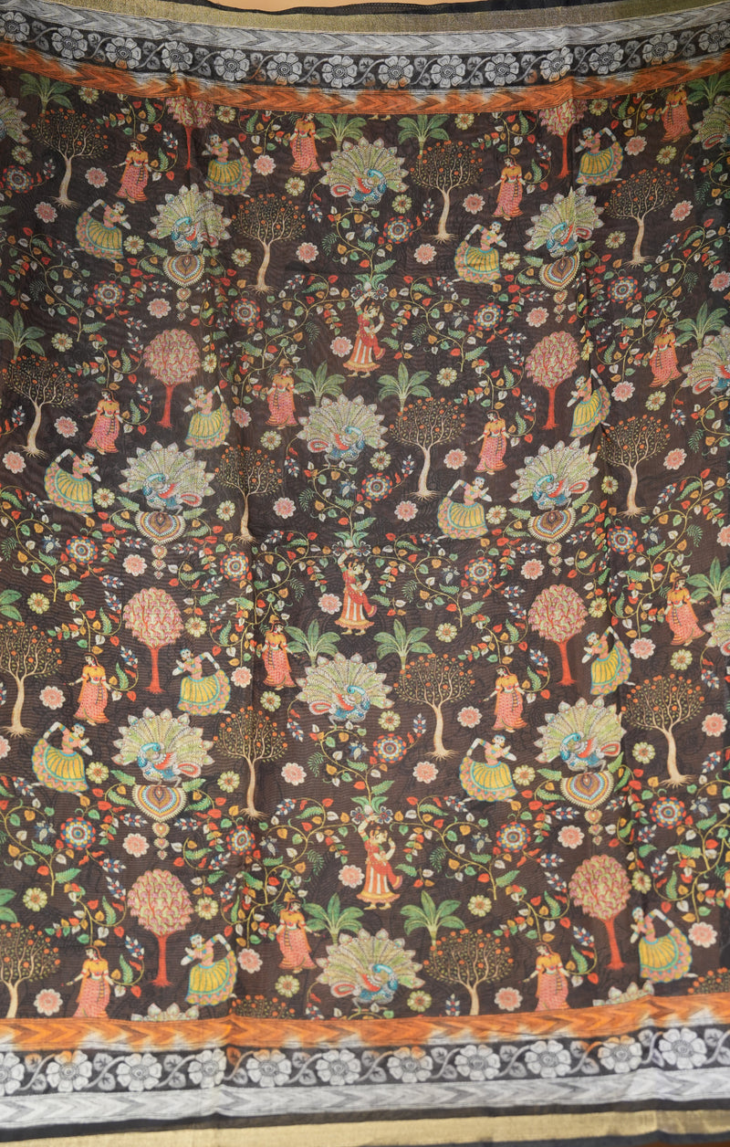 A dark brown fabric featuring an intricate, colorful traditional folk art print of trees, flowers, and figures, finished with a decorative patterned border.
