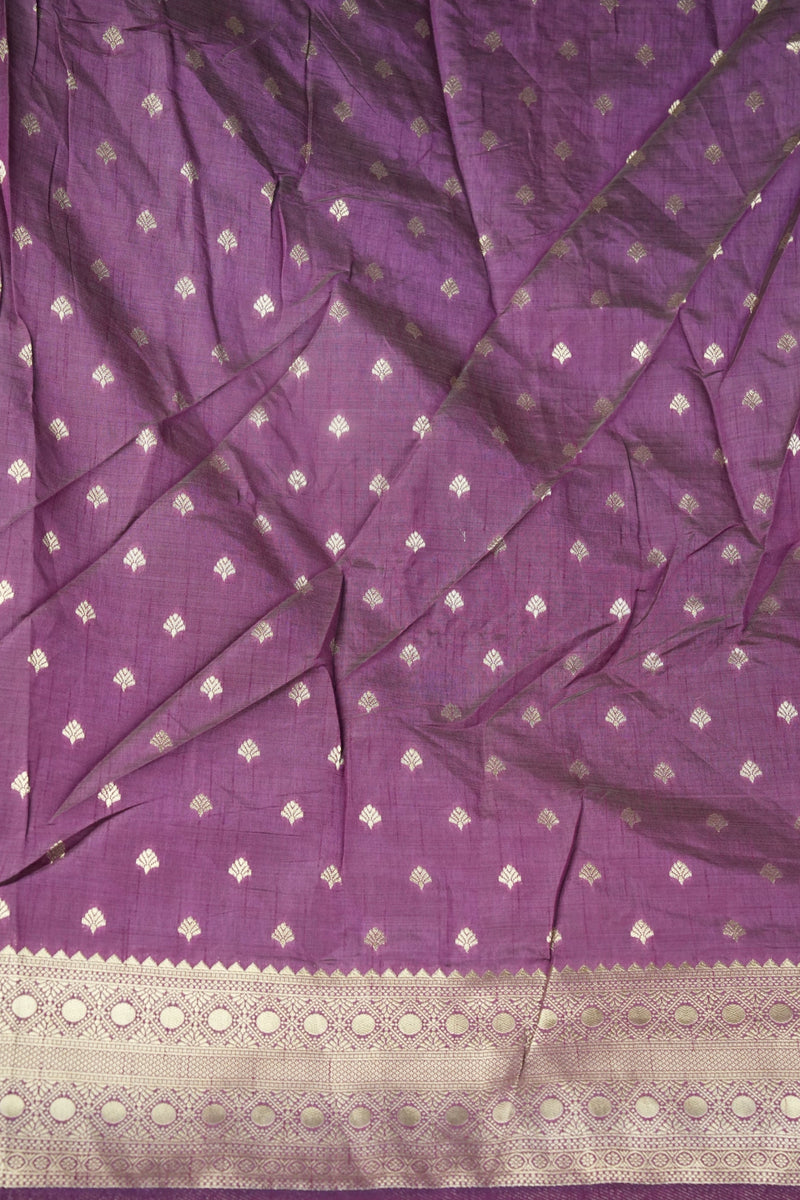 Purple silk saree fabric with small silver zari motifs and a wide beige border.