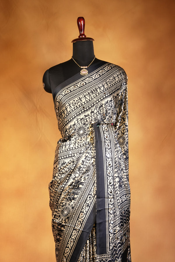 Masakali Satin Saree | Black & Gold Warli Tribal Print with Floral Border | Ethnic Wear