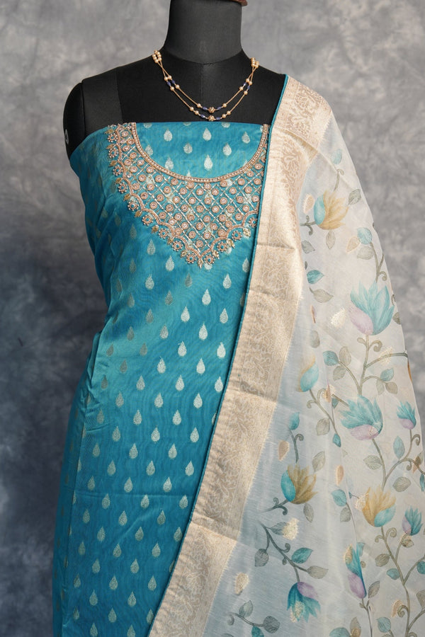 Sari with floral and polka dot patterns on a gray background