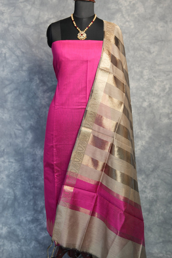 Traditional umbrella with pink and brown pattern on a gray background
