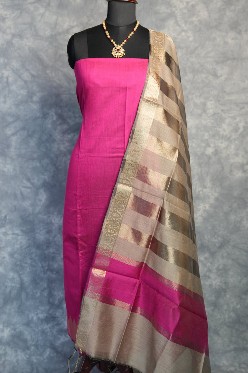 Traditional umbrella with pink and brown pattern on a gray background