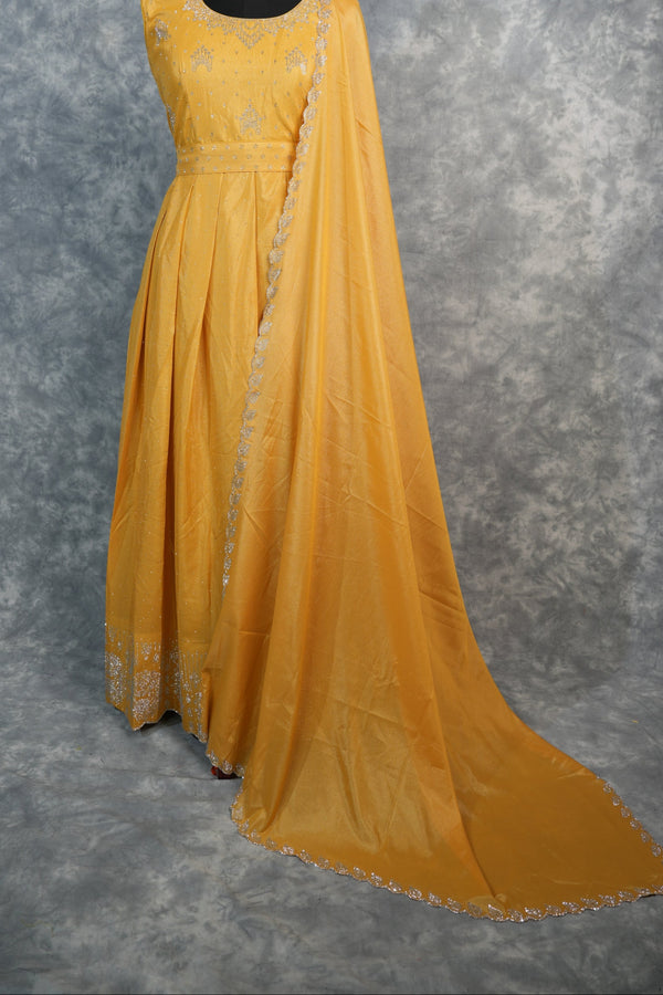 Yellow Chiffon Stone Chudi Maxi Set - A radiant yellow chiffon maxi set adorned with delicate stone detailing that adds a subtle sparkle. Designed with a graceful flow and lightweight comfort, it offers an elegant.