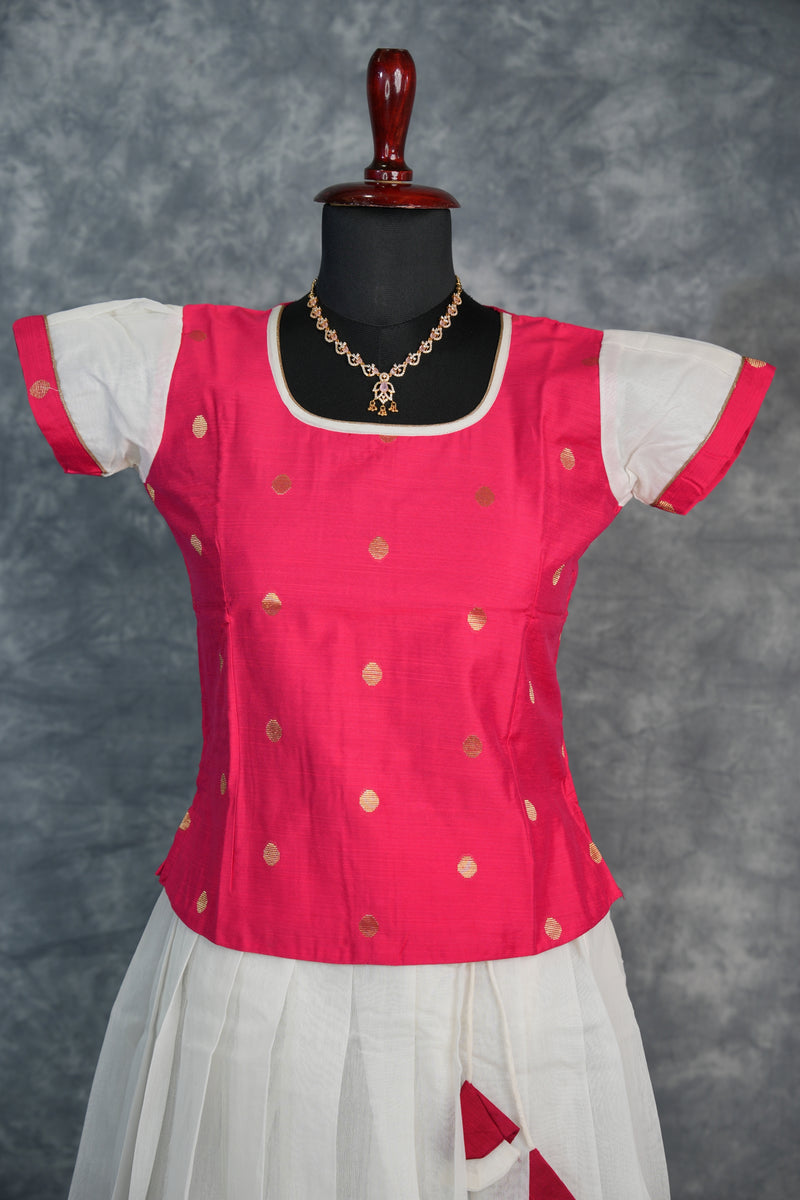 Red and white traditional outfit with gold patterns on a gray background