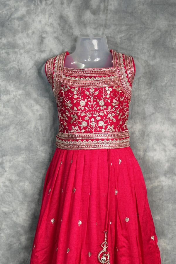 Rani Pink Girls Midi A charming rani pink midi dress designed with a graceful silhouette and elegant detailing. Perfect for festive occasions, parties, and stylish ethnic wear looks.