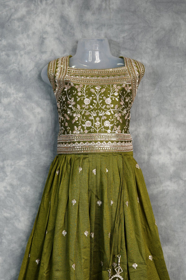 Olive Green Girls Midi – A charming green midi dress designed with a graceful silhouette and stylish detailing. Crafted for comfort and elegance, perfect for festive occasions and trendy ethnic styling.