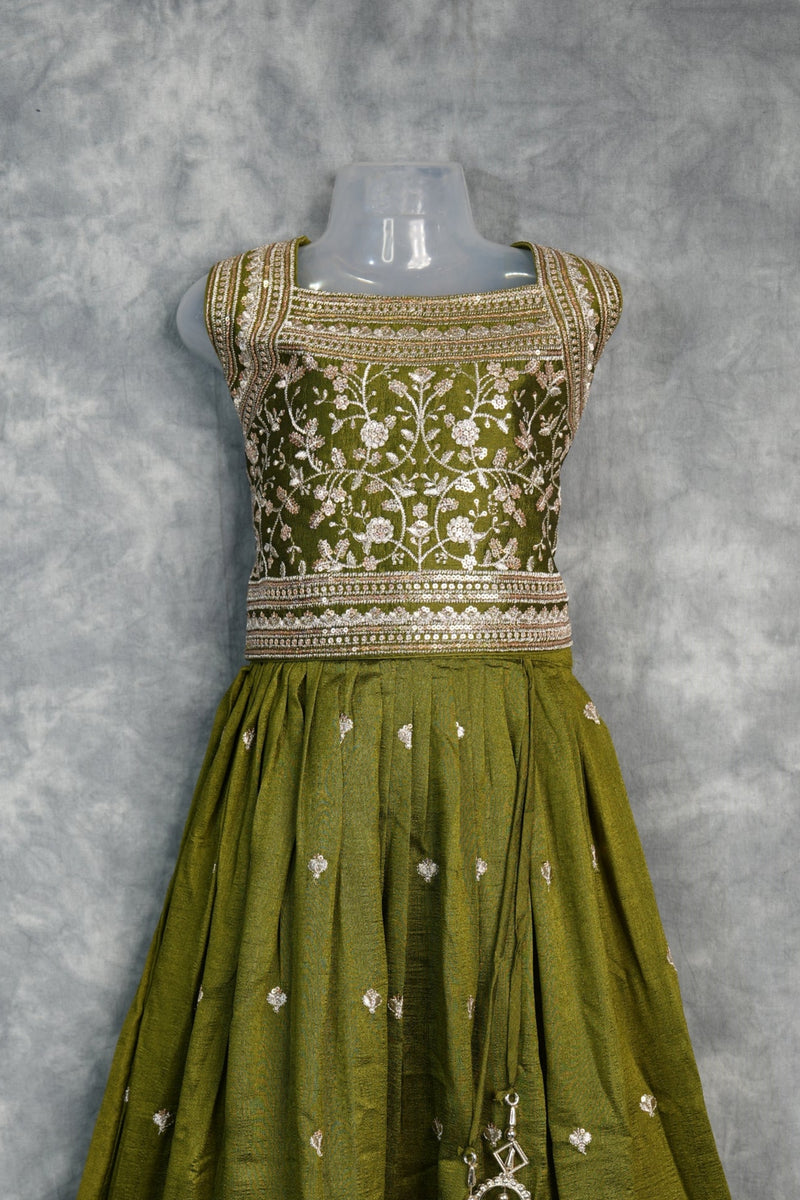 Olive Green Girls Midi – A charming green midi dress designed with a graceful silhouette and stylish detailing. Crafted for comfort and elegance, perfect for festive occasions and trendy ethnic styling.